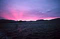 Shadow bands in the pinkish glow of a Southeast Alaska sunset.