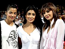 Shriya (center) with Mugdha Godse (left) and Mrinalini Shrama (right) at CCL match