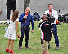 Presenters and camera operator of Sky Sports F1 on an outside broadcast in 2014. Sky Sports British GP 2014 Croft & Herbert 001.jpg