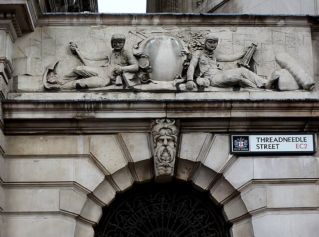 Heraldic grouping above main entrance to the surviving South Sea House, Threadneedle Street, rebuilt after the fire of 1826