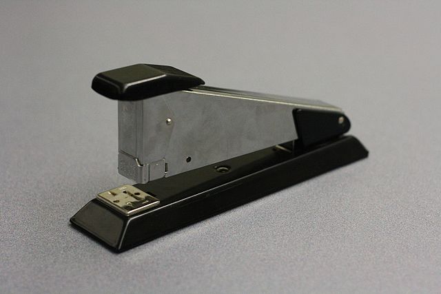 A spring-loaded stapler