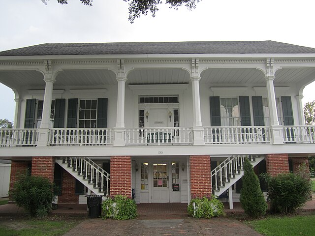 The Tensas Parish Library is housed on the ground floor of this former residence, built c. 1858 by a local merchant and partially restored in 1964. Th