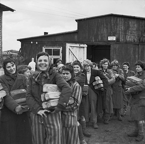 Women survivors in Bergen-Belsen collecting their bread ration after their liberation, April 1945