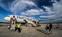 A Thomas Cook Airlines Airbus A330-200 boarding passengers