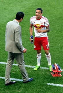 Cahill with the New York Red Bulls in May 2013 Tim Cahill talks to Mike Petke.jpg