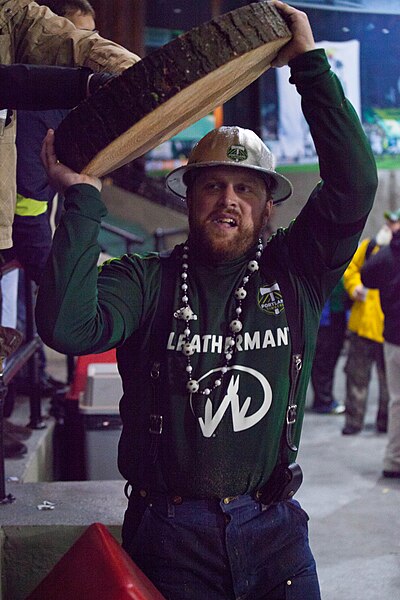 Timber Joey displaying the slice of wood chopped during a match to celebrate each Timbers goal.
