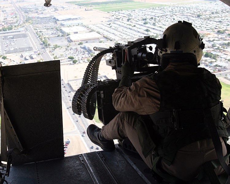 File:US Navy 071211-M-6020M-005 U.S. Marine Cpl. Corey Fellenzer, a crew chief with Marine Heavy Helicopter Squadron (HMH) 462, surveys the area while manning a 50-caliber machine gun.jpg