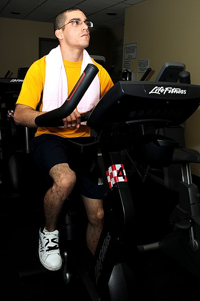 File:US Navy 100429-N-7732W-006 aster-at-Arms Seaman Jaymi Perez works out on a stationary bike at the base Fitness and Aquatic Center as a part of his cardiovascular training to prepare for the upcoming physical fitness assessment.jpg