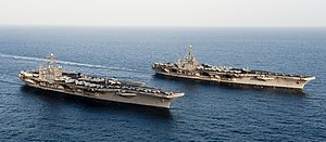 US Navy 120119-N-OY799-174 The Nimitz-class aircraft carriers USS John C. Stennis (CVN 74) and USS Abraham Lincoln (CVN 72) transit during a turnov.jpg