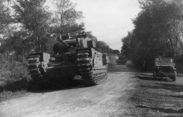 A Churchill tank leads a troop of Sherman flail tanks of the specialist 79th Armoured Division during the assault on Boulogne, September 1944