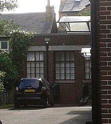 Sukkah, with roof part-open Wilson Road Synagogue Succah.JPG