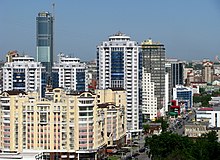 Aquamarine apartment complex with the topped out 188-meter Vysotsky skyscraper in the background