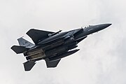 An F-15E Strike Eagle, tail number 97-0218, taking off from RAF Lakenheath in England. The aircraft is assigned to the 492nd Fighter Squadron.