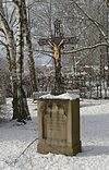 Wayside cross at the allotment garden in the snow