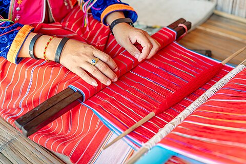 A Karen woman in Thailand weaving