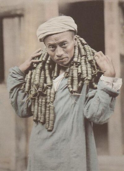 A Sichuanese man carrying 13,500 cash coins.