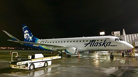 Embraer 175, owned and operated by SkyWest for Alaska Airlines, parked at the gate at Fresno Yosemite International Airport.