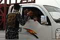 An Iraqi policeman stops a truck on Highway 1 performing a route sanitation mission at Scania, Iraq, Sept 110923-A-OB692-278.jpg