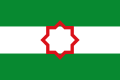 Bandera nacionalista andaluza con la estrella tartésica, variante más moderna y menos común que las anteriores.[5]​