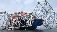 Wreckage of the Francis Scott Key Bridge with the Dali underneath Army Corps of Engineers is supporting recovery operations following Francis Scott Key Bridge collapse (240326-A-SE916-6741).jpg