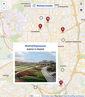 a manually added red marker and nearby articles on a Kartographer map