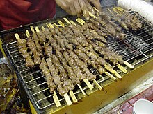 Chuan-style lamb kebab sticks sold by a street vendor