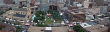 East Town during Bastille Days, facing south toward downtown; Cathedral of St. John the Evangelist on the left. Bastille Days Milwaukee Wisconsin.jpg