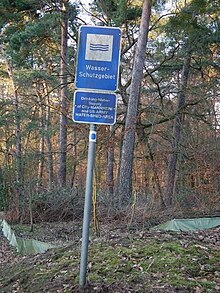 Sign near Mannheim, Germany, indicating a zone as a dedicated "groundwater protection zone" Blaues Hinweisschild Wasserschutzgebiet.JPG