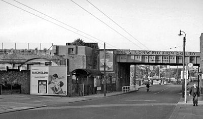The former Brentford GWR Station view eastward on Brentford High Street. The station, on a branch from Southall to Brentford Docks, had been on the left. The passenger station and the service from Southall were closed in May 1942, but although Brentford Dock was closed in 1964, goods trains ran to Brentford Town Goods until December 1970.