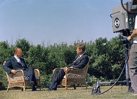 Cronkite interviews President John F. Kennedy to inaugurate the first half-hour nightly news broadcast in 1963