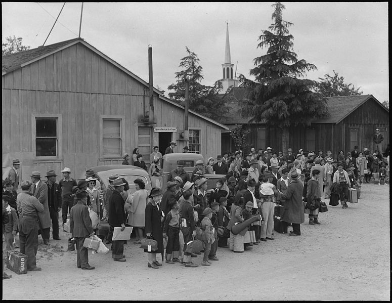 File:Centerville, California. Members of farm families await evacuation bus. Farmers and other evacuees . . . - NARA - 537574.jpg