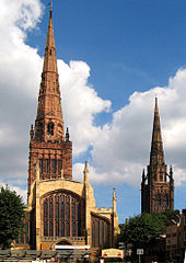 Two of the three spires of Coventry: Holy Trinity Church to the left, and the remains of the 14th Century St. Michael's Cathedral to the right Coventry spires-2Aug2005-2rc.jpg