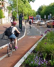 Cyclists using the cycle lane on Oxford Road, passing an electronic bicycle counter Cycle lane on Oxford Road, Manchester with counter.jpg