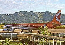 Nadi Airport in 1971 showing the open-sided covered walkways between the aircraft and terminal. A Canadian Pacific Air Lines DC-8 is pictured.