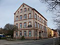 Factory building with side fence