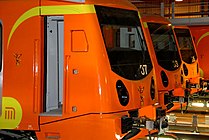 Three Mexico City Metro trains are parked.