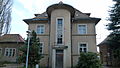 Administration building with two outbuildings and fencing