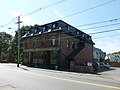 Greenwood Brothers store, located at 573 Lawrence Street, Lowell, Massachusetts. East (front) and north sides of building shown.