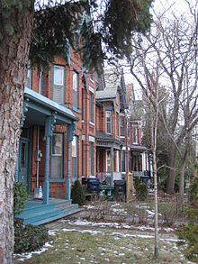 Bay-and-gable-styled houses in Harbord Village. The area was initially built up as a working class and lower middle class community in the late-19th century. Harbord Village.JPG