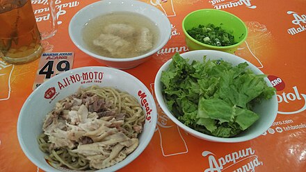 A set of jakarta ayam kampung-style mie ayam with suikiaw (prawn dumpling) soup and lettuce.