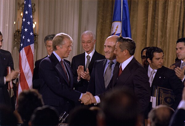 Jimmy Carter and Omar Torrijos shake hands moments after the signing of the Torrijos–Carter Treaties.
