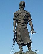 Estatua del lazador, arouez kêr Porto Alegre (Brazil) Paixão Côrtes e voe patrom an oberour Antônio Caringi e 1954