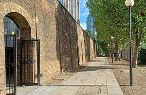 The boundary wall, on the west side of the Republic office campus London Borough of Tower Hamlets - East India Dock Boundary Wall - 20220904171108.jpg