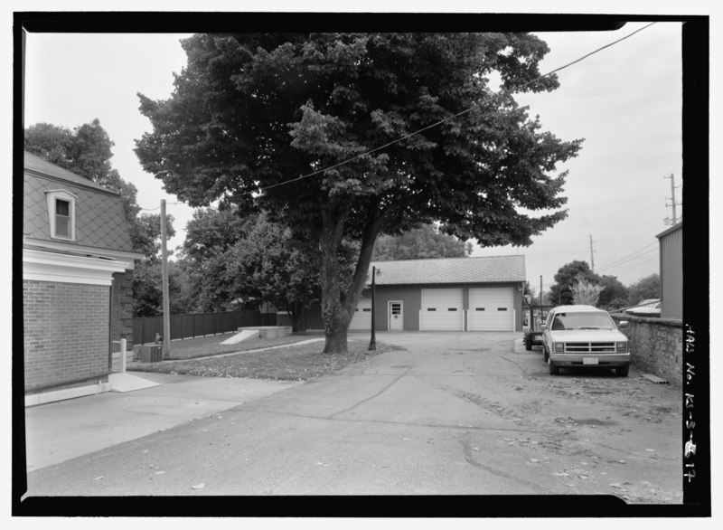 File:MAINTENANCE YARD, WITH TORNADO SHELTER, TREE, FENCING, AND MAINTENANCE BUILDING. VIEW TO NORTH. - Fort Scott National Cemetery, 900 East National Avenue, Fort Scott, Bourbon County, KS HALS KS-3-17.tif