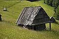 An meadow chalet in Maramureş Mountains, Romania under the Pop Ivan Massif.