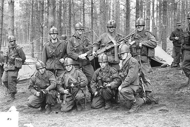 Dutch soldiers of 11 Pantserinfanteriebataljon Garderegiment Grenadiers wearing mohawk-style additions on their helmets to denote opposing force statu