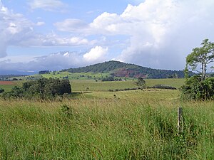 Mt Quincan, viewed from the south, showing the southern quarry with the main scoria cone behind it to the west and the low-lying crater to the east.