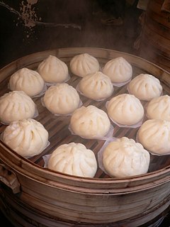 Nikuman Japanese dish of dumplings stuffed with meat, derived from the Chinese baozi