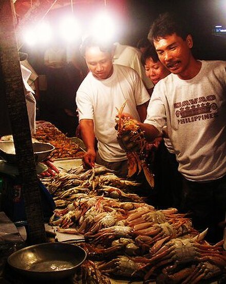 A man selects fish for his dish at the Pala-pala market