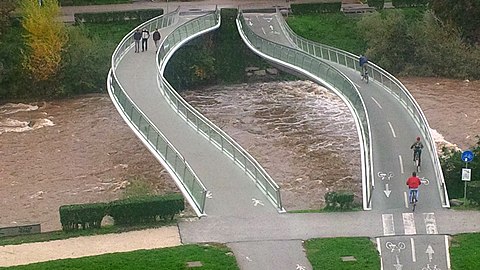 A pedestrian and a nearby bicycle bridge in Bozen,